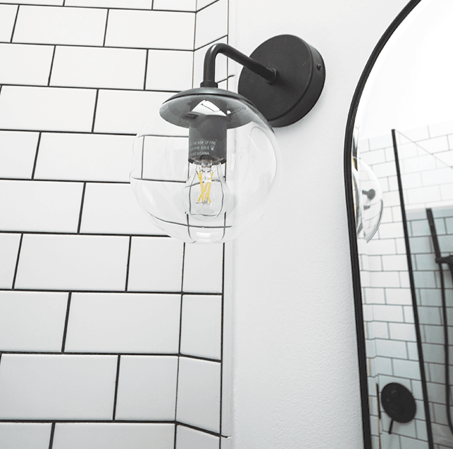 spherical incandescent bulb with black hardware