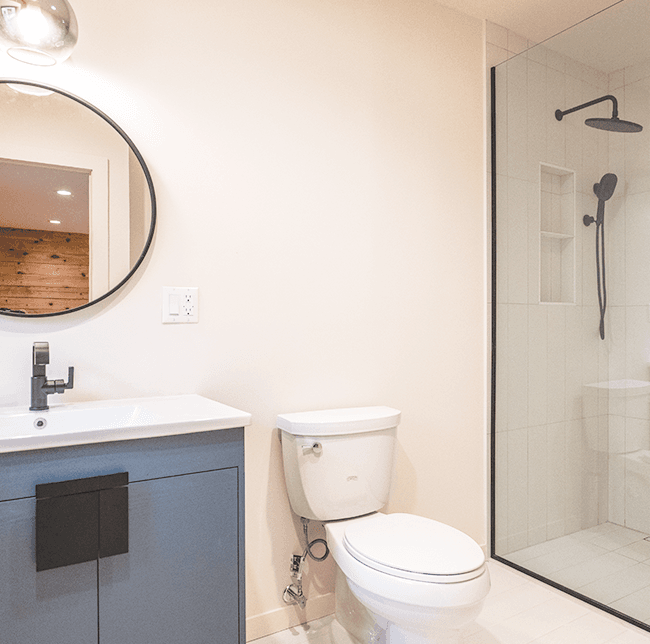elegant white bathroom toilet and grey lavatory