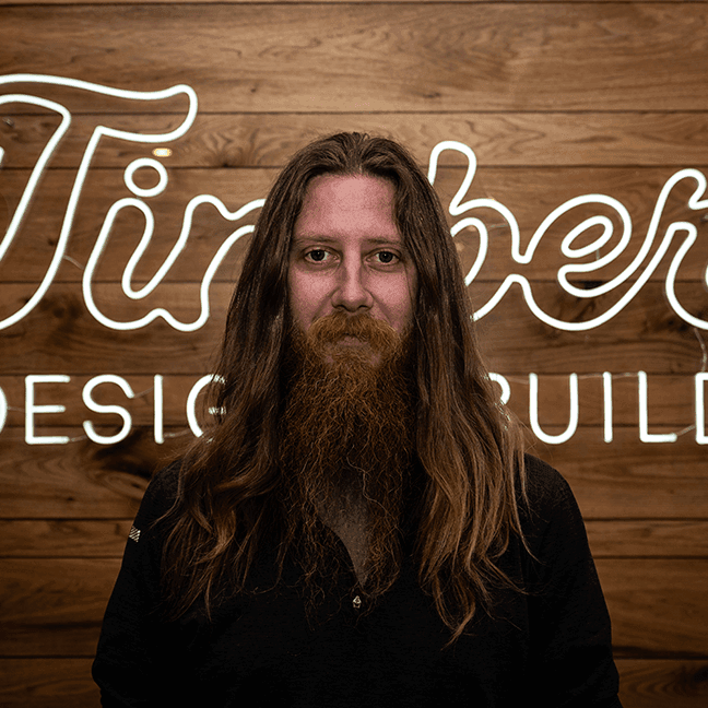 chris Chris Rall, Founder and Chief Operating Officer at Timber Design and Build, overseeing operations and custom home construction.